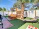 Relaxing backyard with hot tub, lounge chair, and lush landscaping at 1887 Springtime Ave, Clearwater, FL 33755