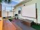 Enjoy outdoor movies with a projector screen and grill on the deck at 1887 Springtime Ave, Clearwater, FL 33755