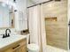 Updated bathroom featuring stylish tiling, modern fixtures, and a shower niche at 1887 Springtime Ave, Clearwater, FL 33755