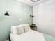 Cozy bedroom with a soothing color scheme, and stylish wall sconces at 1887 Springtime Ave, Clearwater, FL 33755