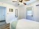 Bedroom featuring an exterior door and a ceiling fan at 1887 Springtime Ave, Clearwater, FL 33755