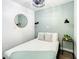 Cozy bedroom features modern light fixtures and a stylish accent wall at 1887 Springtime Ave, Clearwater, FL 33755