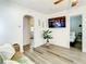Relaxing living space with a sofa, TV, and a view into a bedroom and another room at 1887 Springtime Ave, Clearwater, FL 33755