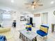 Bright and airy living room seamlessly connects to a modern kitchen, complete with stylish furniture at 1887 Springtime Ave, Clearwater, FL 33755