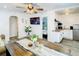 Open-concept living area with a dining space, TV, and view into the bedroom and kitchen at 1887 Springtime Ave, Clearwater, FL 33755