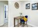 Small office nook featuring a desk, chair, and stylish wall decor at 1887 Springtime Ave, Clearwater, FL 33755
