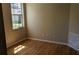 Bright bedroom with hardwood floors and a window at 19251 Stone Hedge Dr, Tampa, FL 33647