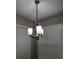 Stylish chandelier illuminates the space, complemented by natural light filtering through window blinds at 19251 Stone Hedge Dr, Tampa, FL 33647