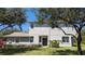 Charming two-story home with a well-manicured lawn and tasteful landscaping at 19251 Stone Hedge Dr, Tampa, FL 33647