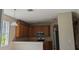 Kitchen featuring wooden cabinets, a microwave, stainless steel appliances, and recessed lighting at 19251 Stone Hedge Dr, Tampa, FL 33647