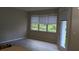 Bright living room with large window and lots of natural light and access to the porch at 19251 Stone Hedge Dr, Tampa, FL 33647