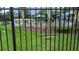 Community swimming pool area with clear blue water, lounge chairs, and sun umbrellas at 19251 Stone Hedge Dr, Tampa, FL 33647