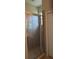 Glass-enclosed shower stall with a tile surround in a bathroom with neutral finishes at 19251 Stone Hedge Dr, Tampa, FL 33647