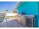 Outdoor grill and built-in refrigerator on back patio at 2010 E Vina Del Mar Blvd, St Pete Beach, FL 33706