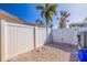 Private fenced backyard with shell landscaping and ample space, perfect for outdoor entertaining at 2010 E Vina Del Mar Blvd, St Pete Beach, FL 33706