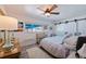 Bright bedroom with ceiling fan, barn style closet door and large window at 2010 E Vina Del Mar Blvd, St Pete Beach, FL 33706