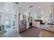 Bright, open kitchen features stainless steel appliances, granite countertops, and seamless flow into the living areas at 2010 E Vina Del Mar Blvd, St Pete Beach, FL 33706