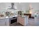Open kitchen with modern appliances and spacious countertops, overlooks the living area and a large window view at 2010 E Vina Del Mar Blvd, St Pete Beach, FL 33706