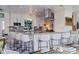 Modern kitchen featuring a stylish island with bar seating, stainless steel appliances, and granite countertops at 2010 E Vina Del Mar Blvd, St Pete Beach, FL 33706
