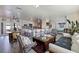 Spacious open-concept living area with a modern kitchen, comfortable seating, and a view of the backyard at 2010 E Vina Del Mar Blvd, St Pete Beach, FL 33706