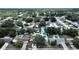 Aerial view of a neighborhood with lush landscaping, swimming pools, and well-maintained homes at 2209 Kingswood Ln, Brandon, FL 33511