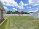 Large grassy backyard, surrounded by a privacy fence at 2209 Kingswood Ln, Brandon, FL 33511