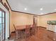 Cozy dining room featuring a wooden table set, wood floors, and a bright ambiance at 2209 Kingswood Ln, Brandon, FL 33511