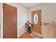 Foyer showcasing decorative wallpaper and wooden floors at 2209 Kingswood Ln, Brandon, FL 33511
