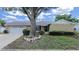 Beautiful single-story home with a two car garage and mature landscaping at 2209 Kingswood Ln, Brandon, FL 33511