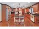 Spacious kitchen with stainless steel appliances, granite countertops, and a central island with seating at 2209 Kingswood Ln, Brandon, FL 33511