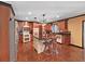 Traditional kitchen with updated appliances, wood floors, and a center island at 2209 Kingswood Ln, Brandon, FL 33511