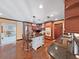 Kitchen showcasing granite countertops, a large island with seating, and stainless steel appliances at 2209 Kingswood Ln, Brandon, FL 33511