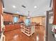 Well-appointed kitchen with a large island, stainless steel fridge, and adjacent dining area for Gathering meals at 2209 Kingswood Ln, Brandon, FL 33511
