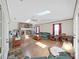 Spacious living room with a brick fireplace, wood floors, and skylights at 2209 Kingswood Ln, Brandon, FL 33511