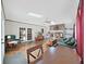 Bright living room with fireplace, skylights, and French doors at 2209 Kingswood Ln, Brandon, FL 33511