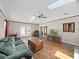 Bright living room with fireplace, skylights, and French doors at 2209 Kingswood Ln, Brandon, FL 33511