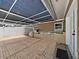 Covered outdoor patio with brick pavers, built-in grill, and countertop space at 2209 Kingswood Ln, Brandon, FL 33511