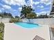 Fenced in backyard pool with lush landscaping around perimeter at 2209 Kingswood Ln, Brandon, FL 33511