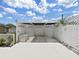 Backyard shed in fenced in yard with beautiful landscaping at 2209 Kingswood Ln, Brandon, FL 33511