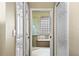 Bathroom doorway leading to walk-in shower at 2221 Platinum Dr, Sun City Center, FL 33573