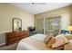 Bright bedroom featuring a sliding glass door and neutral decor at 2221 Platinum Dr, Sun City Center, FL 33573