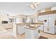 Modern kitchen featuring an island, granite countertops, and an open layout at 2221 Platinum Dr, Sun City Center, FL 33573