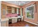 Office with built-in wooden shelving and drawers at 2221 Platinum Dr, Sun City Center, FL 33573