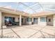 Large brick patio, partially covered with access to the house through sliding glass doors at 2221 Platinum Dr, Sun City Center, FL 33573