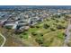 Extensive aerial view of the community showcasing the golf course and residential buildings at 2310 Denmark St # 34, Clearwater, FL 33763