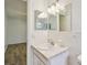 Bathroom featuring white sink with marble countertop and large mirror at 2310 Denmark St # 34, Clearwater, FL 33763