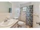 Bathroom with a tile shower and updated vanity at 2310 Denmark St # 34, Clearwater, FL 33763