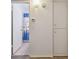 A peek into a bathroom with a shower/tub combo behind a blue shower curtain at 2310 Denmark St # 34, Clearwater, FL 33763