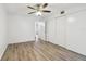 Bedroom featuring wood-look floors and a large closet at 2310 Denmark St # 34, Clearwater, FL 33763
