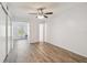 Spacious bedroom with modern ceiling fan and wood-look floors at 2310 Denmark St # 34, Clearwater, FL 33763